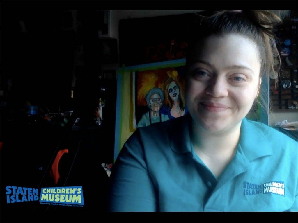 Museum staff smiling in a Youtube video.