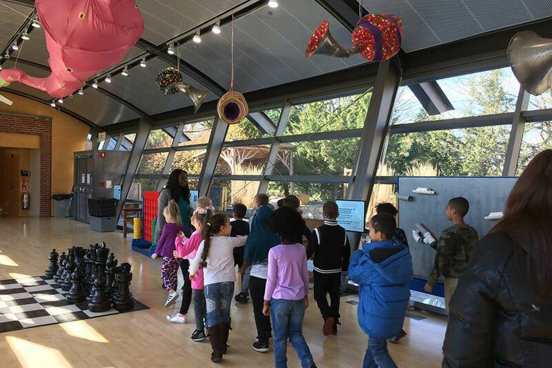 children walking in big games exhibit