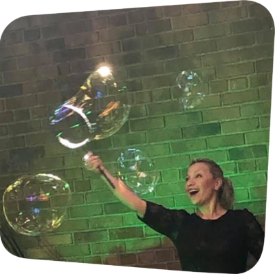 smiling woman surrounded by bubbles