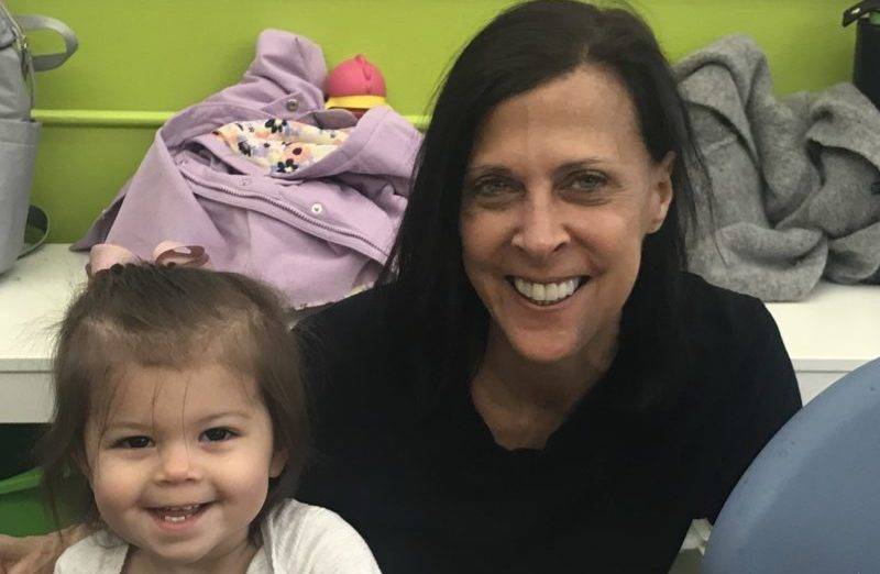 Toddler and Caregiver smiling