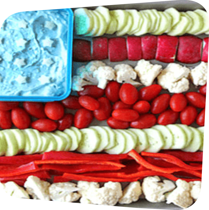 begetables arranged in rows of red and white with a blue corner dip to look like the US flag