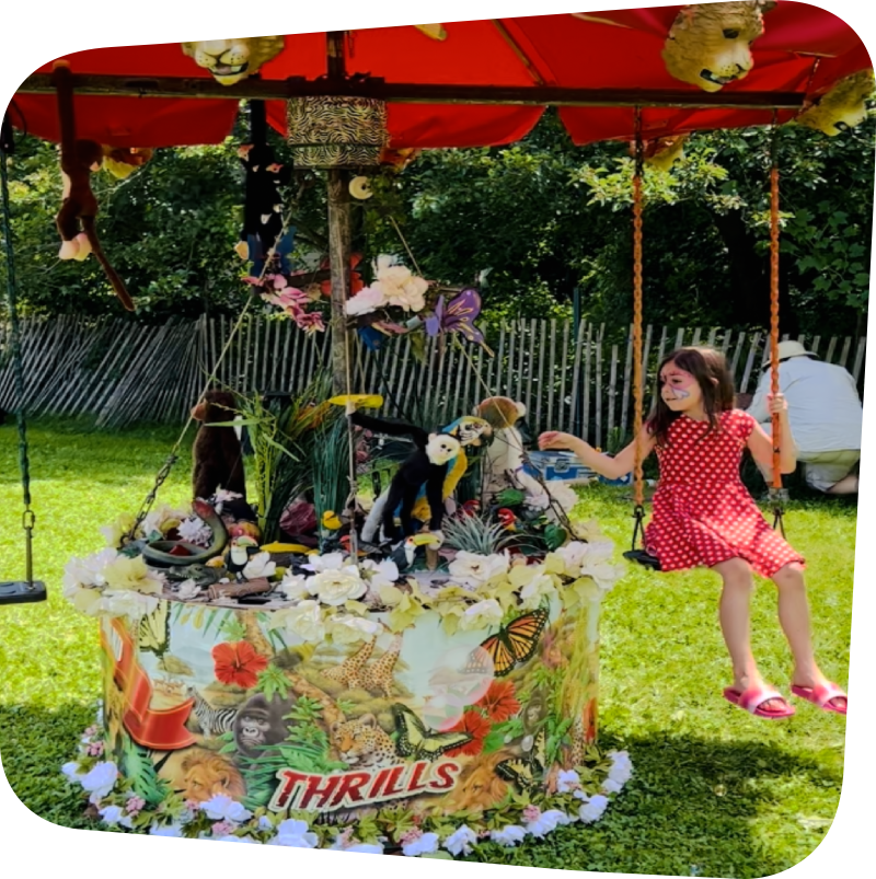 child on carousel swing at Figment Festival