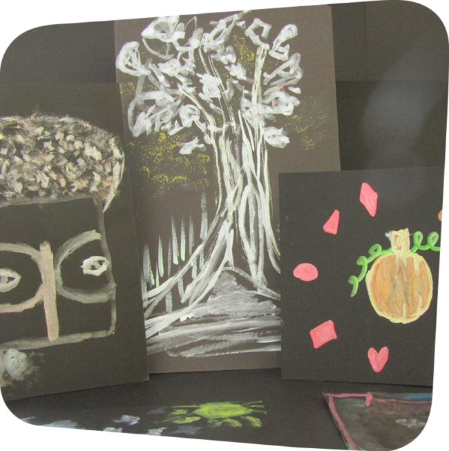 Paintings of an African mask, a tree and a pumpkin made from metallic paints on black paper