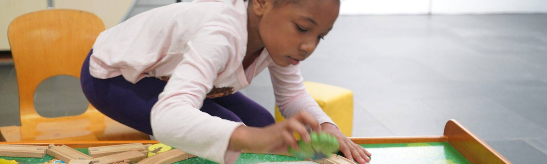 Girl playing with wood blocks