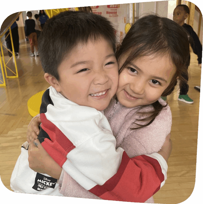 Two kids hugging in House About It