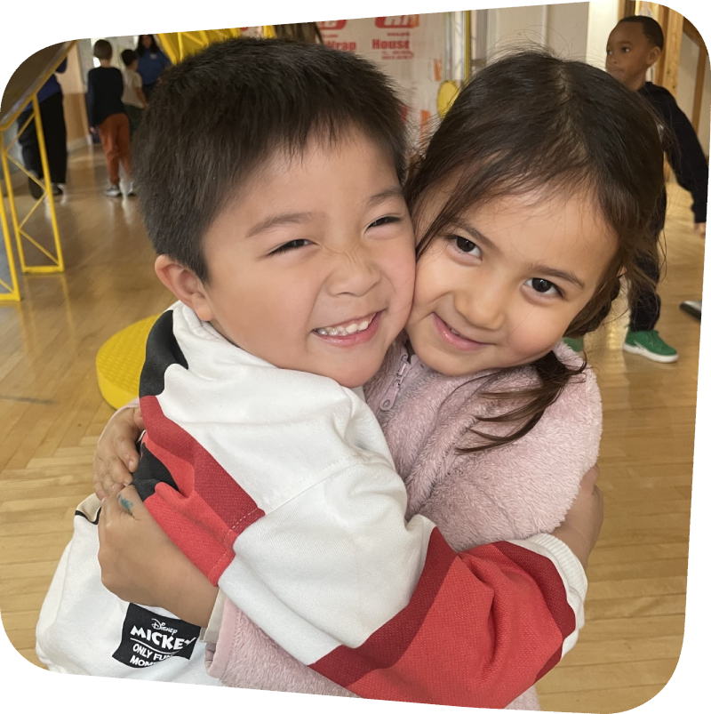 Two kids hugging in House About It