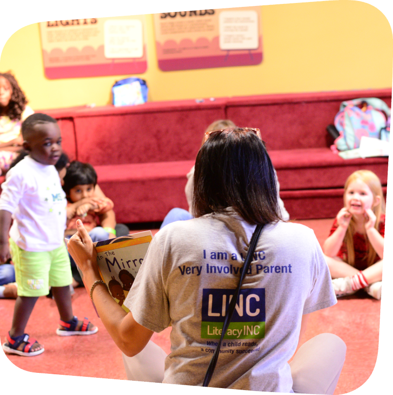 LINC staff reading to kids in Portia's