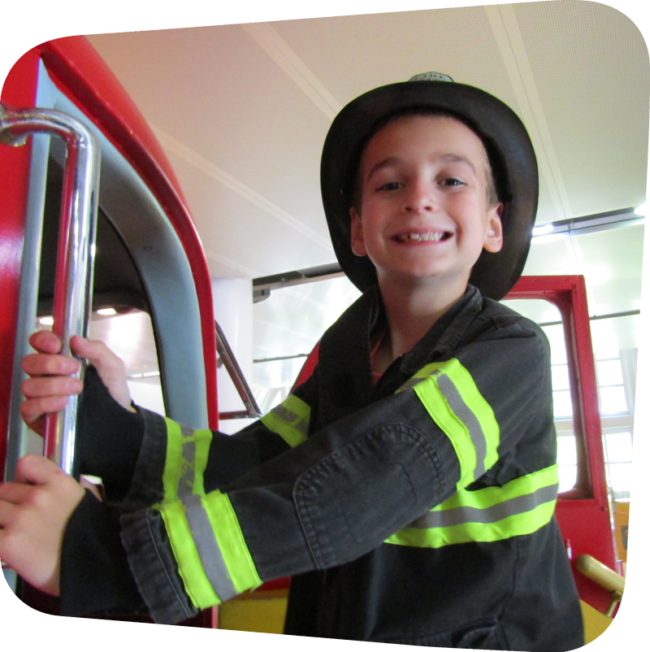 boy dressed as a firefighter in Ladder 11