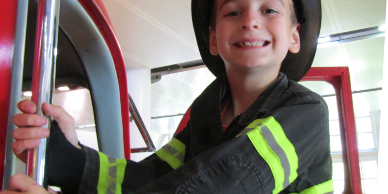 boy dressed as a firefighter in Ladder 11