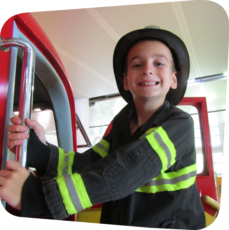 boy dressed as a firefighter in Ladder 11