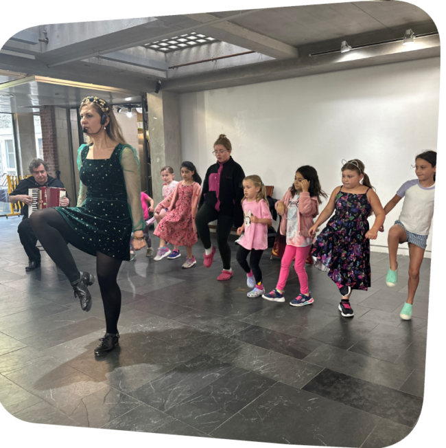 Dawn Daniels teaching kids Irish Step Dance in the gallery
