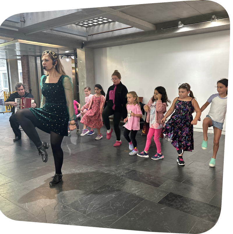 Dawn Daniels teaching kids Irish Step Dance in the gallery