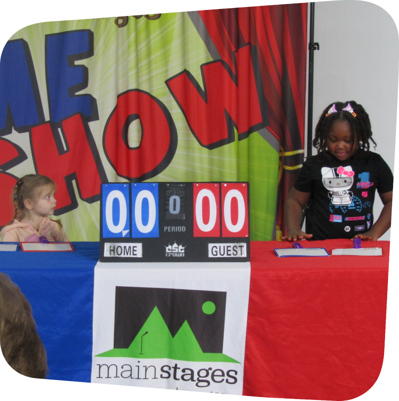two girls playing mainstays game show in gallery