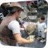 little boy petting a turtle at binx show