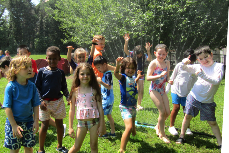 kids playing in sprinklers