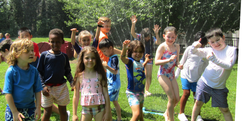 kids playing in sprinklers