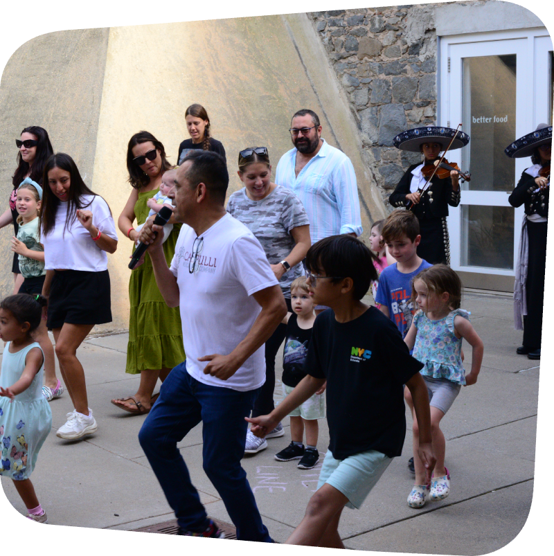 Calpulli dance instructor showing kids dance moves at the Staten Island Children's Museum