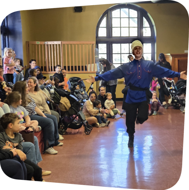 Dancer in traditional Russian outfit performing in front of childrens at the Staten Island Children's Museum