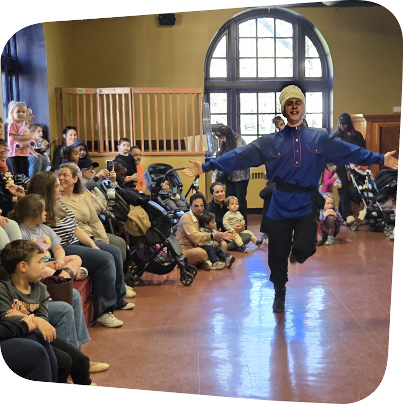 Dancer in traditional Russian outfit performing in front of childrens at the Staten Island Children's Museum