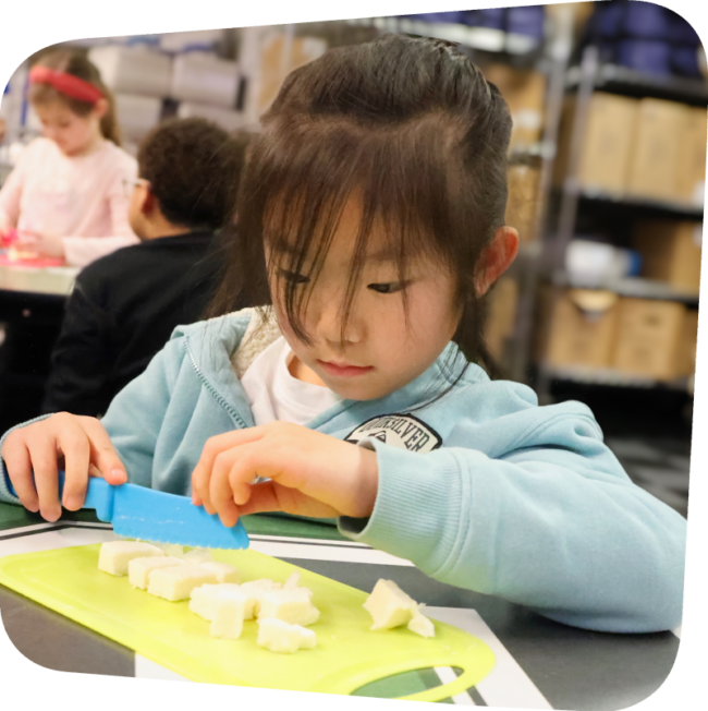 girl chopping ingredients