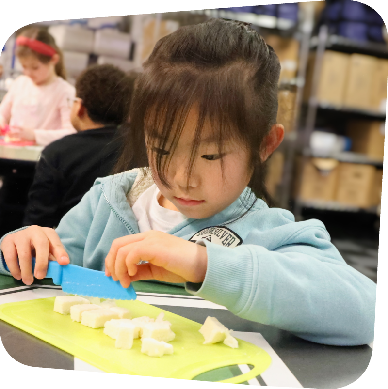 girl chopping ingredients