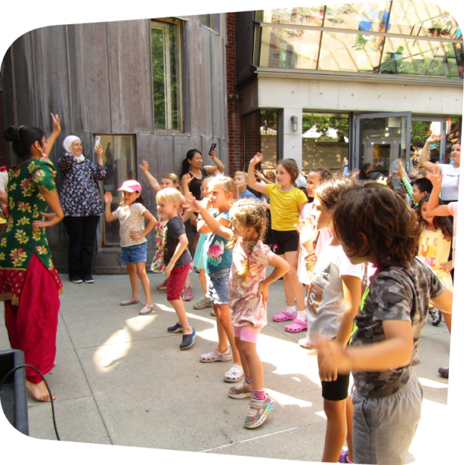 kids following dance instructions outide of the Staten island Children's Museum during an Ajna Dance performance