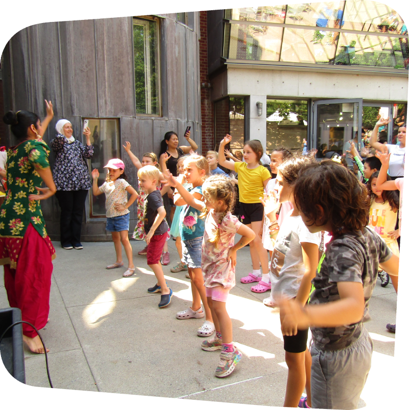 kids following dance instructions outide of the Staten island Children's Museum during an Ajna Dance performance