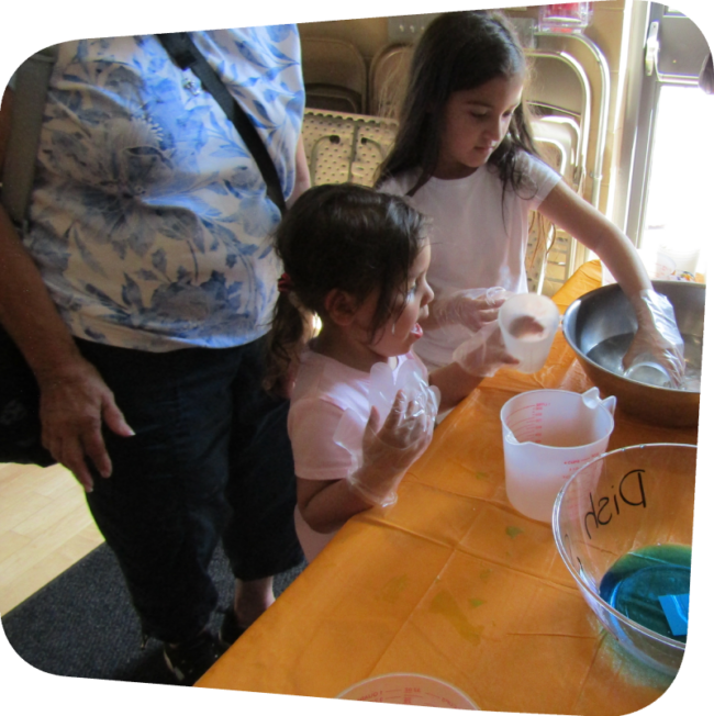 two girls makeing their own bubbles at the Staten island Children's Museum