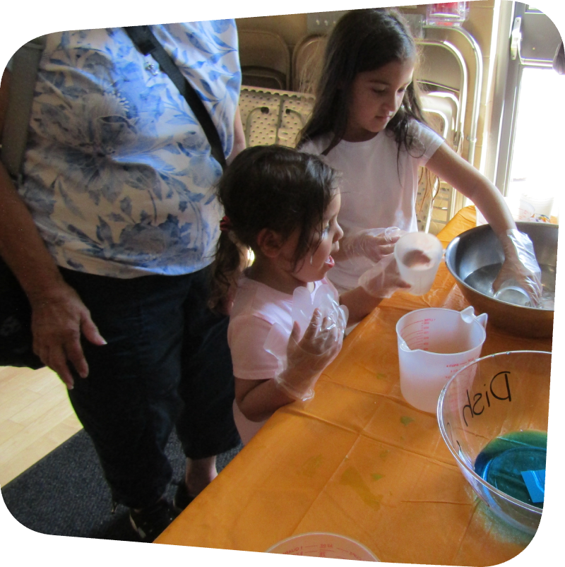two girls makeing their own bubbles at the Staten island Children's Museum