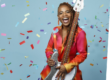 Divi Roxx Kids holding a bass guitar with confetti falling around her