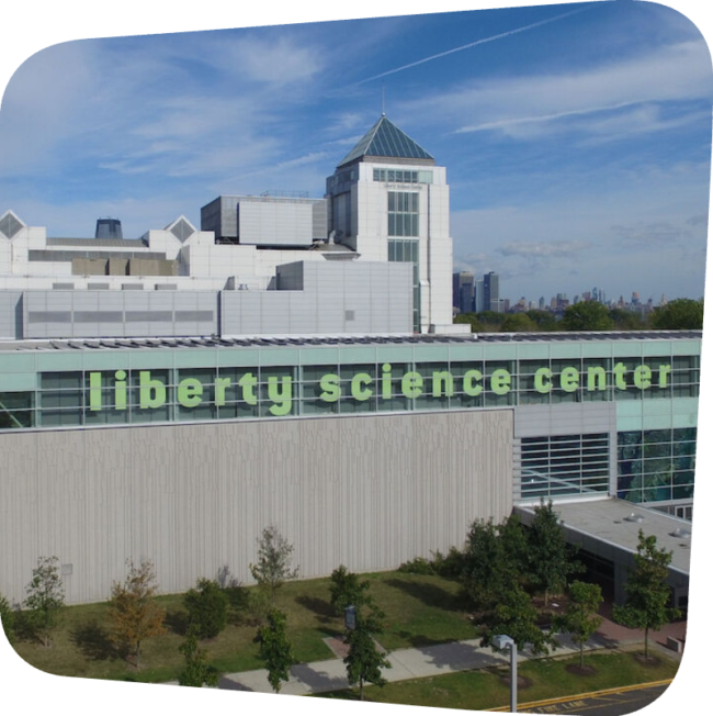 side of the liberty science center building with name of the museum visible