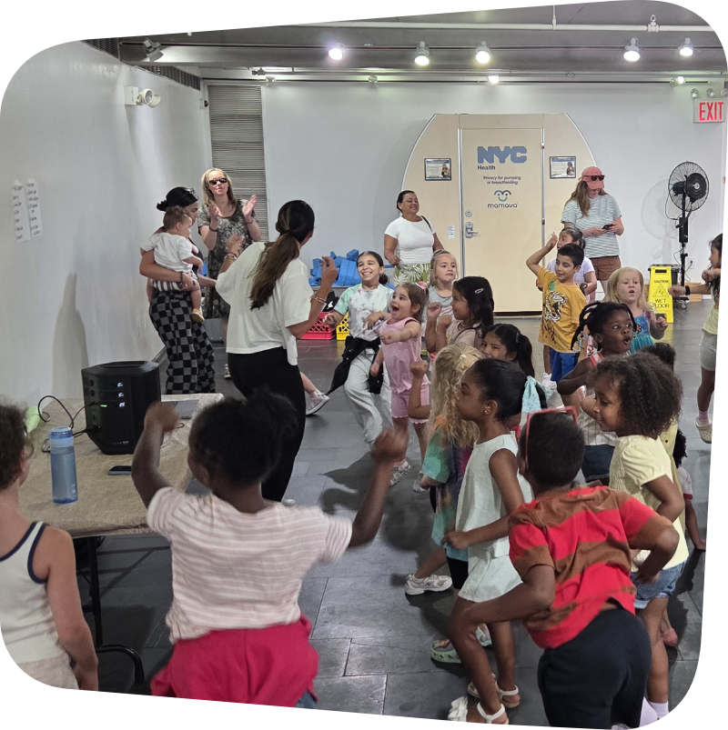 Zumba instructor leading a class with dancing kids at the Staten Island Children's Museum