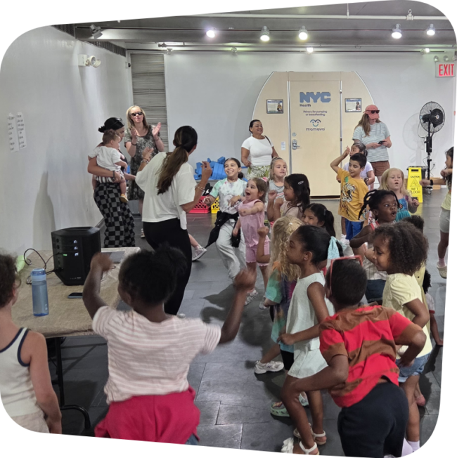 Zumba instructor leading a class with dancing kids at the Staten Island Children's Museum