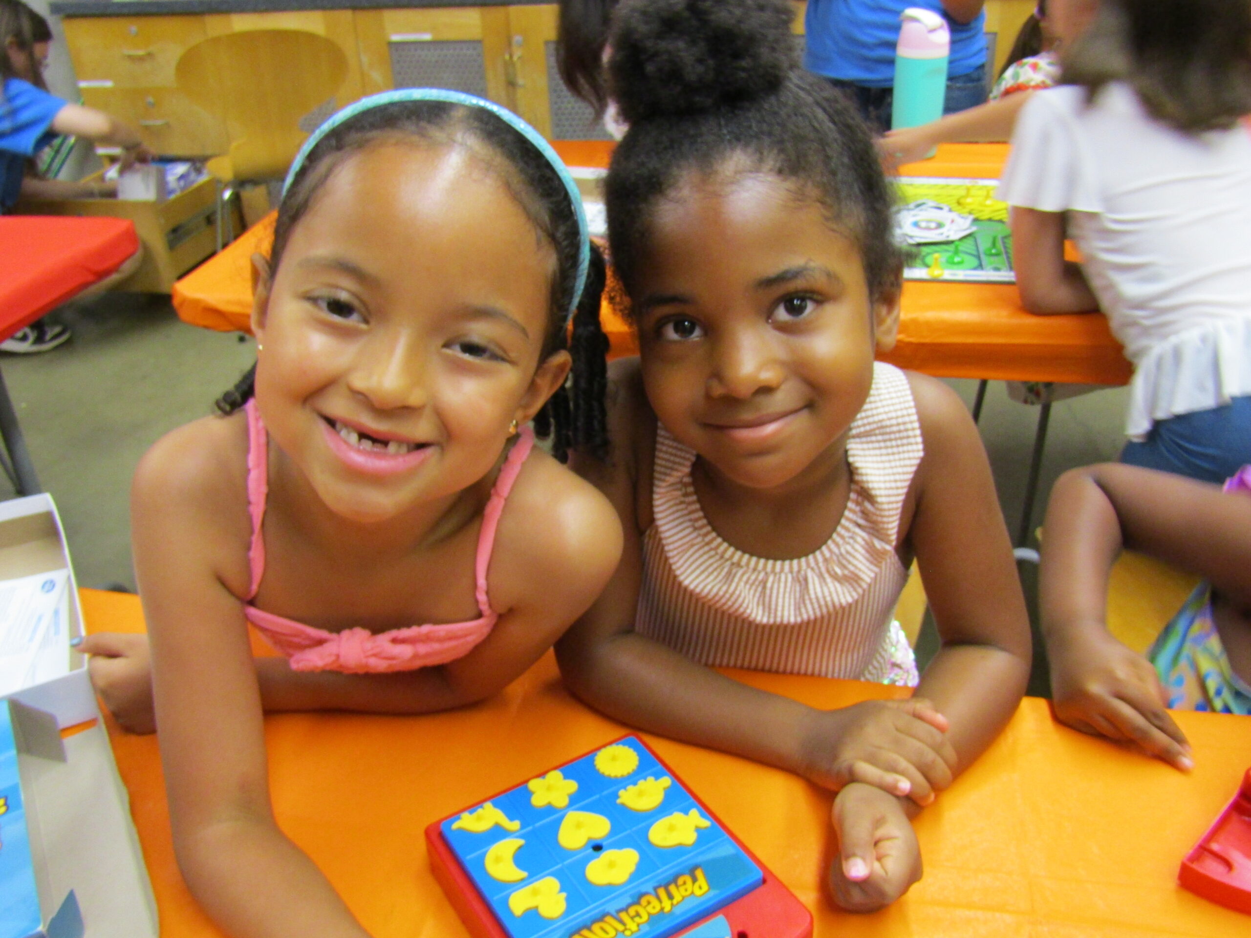 pic for CTI two smiling girls in art classroom att he Staten Island Children's Museum